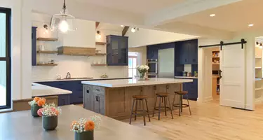 Kitchen showing island with bar seating