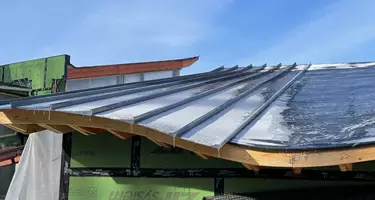 Close up shot of roof construction showing unique undulating roof line
