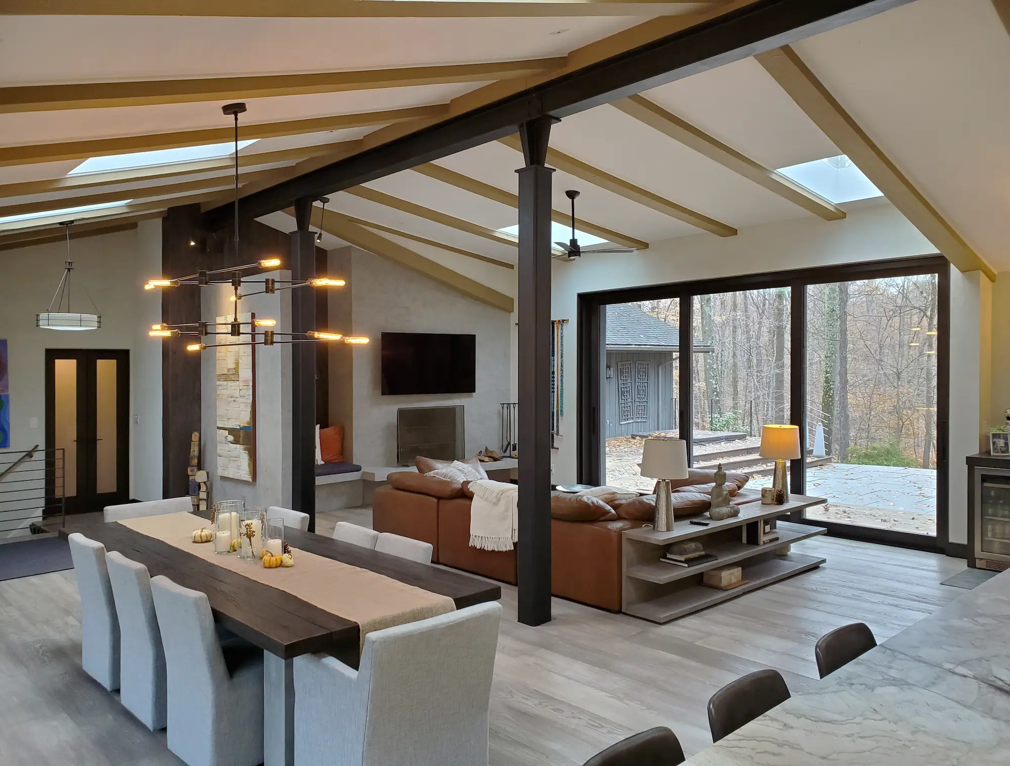 Looking from the corner of the kitchen showing the dining area in the foreground and the living room area in the background