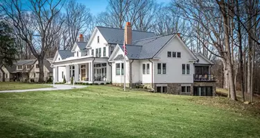 Showing the side of the house and how it is built into the side of the hill on the property